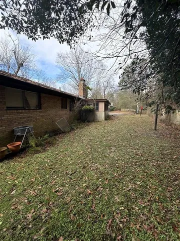 a backyard of a house with lots of green space