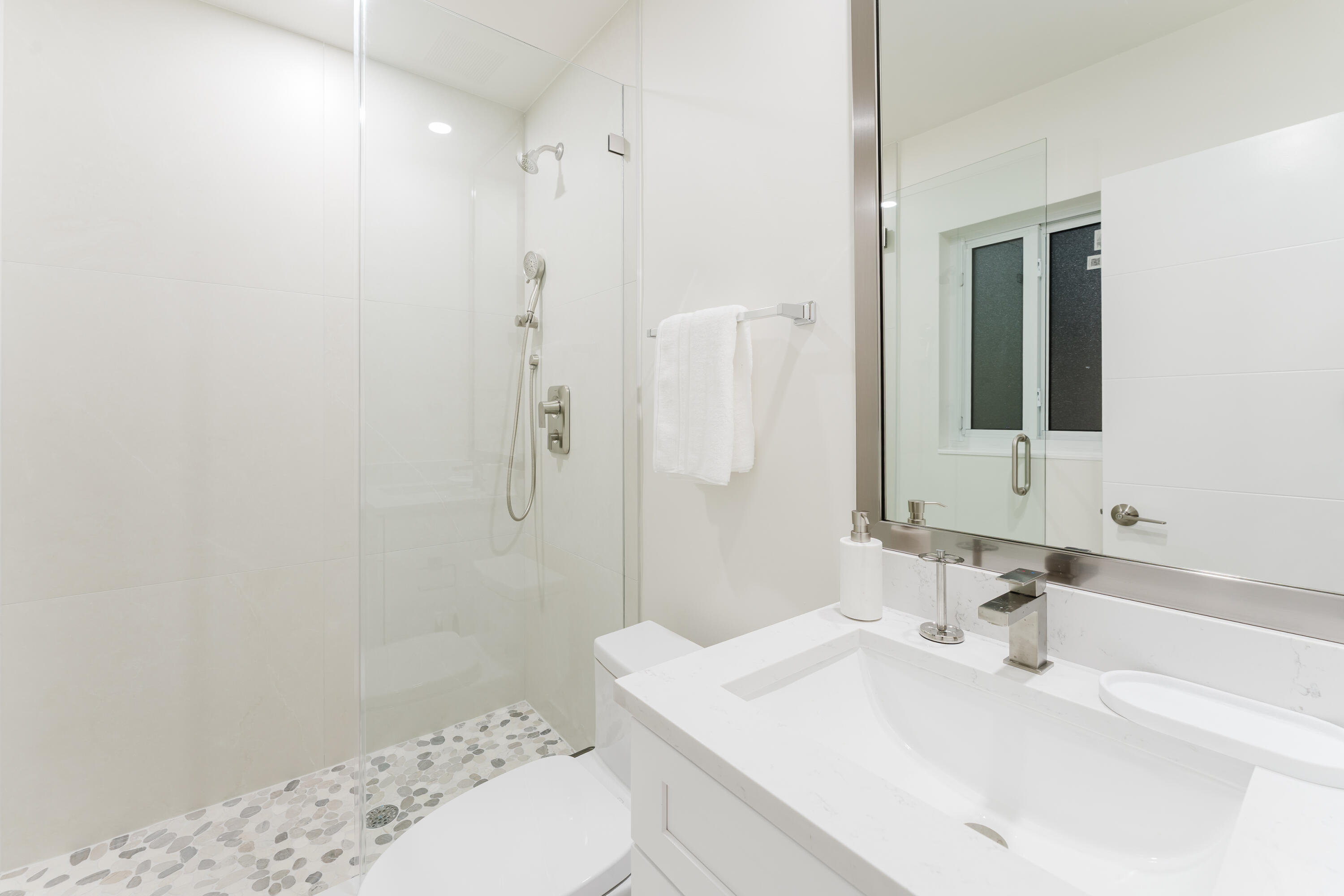 3199 Northeast 6th Drive Boca Raton, FL 33431 - Photo 42 of 49 a bathroom with a sink toilet and shower