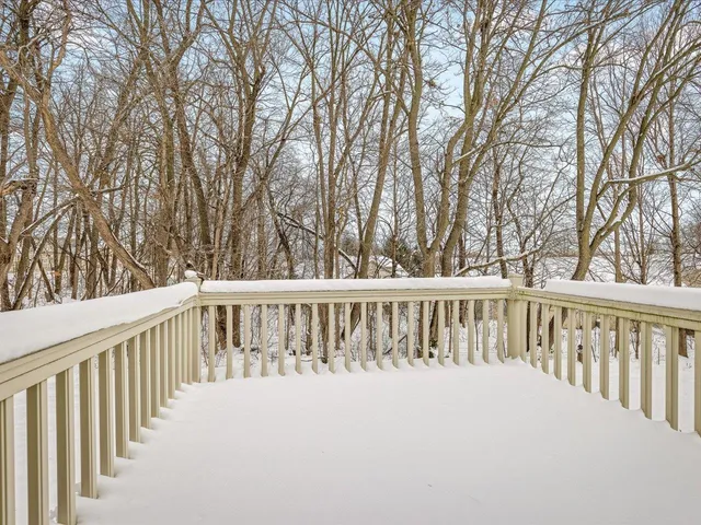 a balcony with trees in front of it