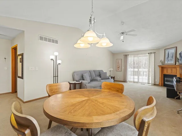 a living room with fireplace furniture and a window