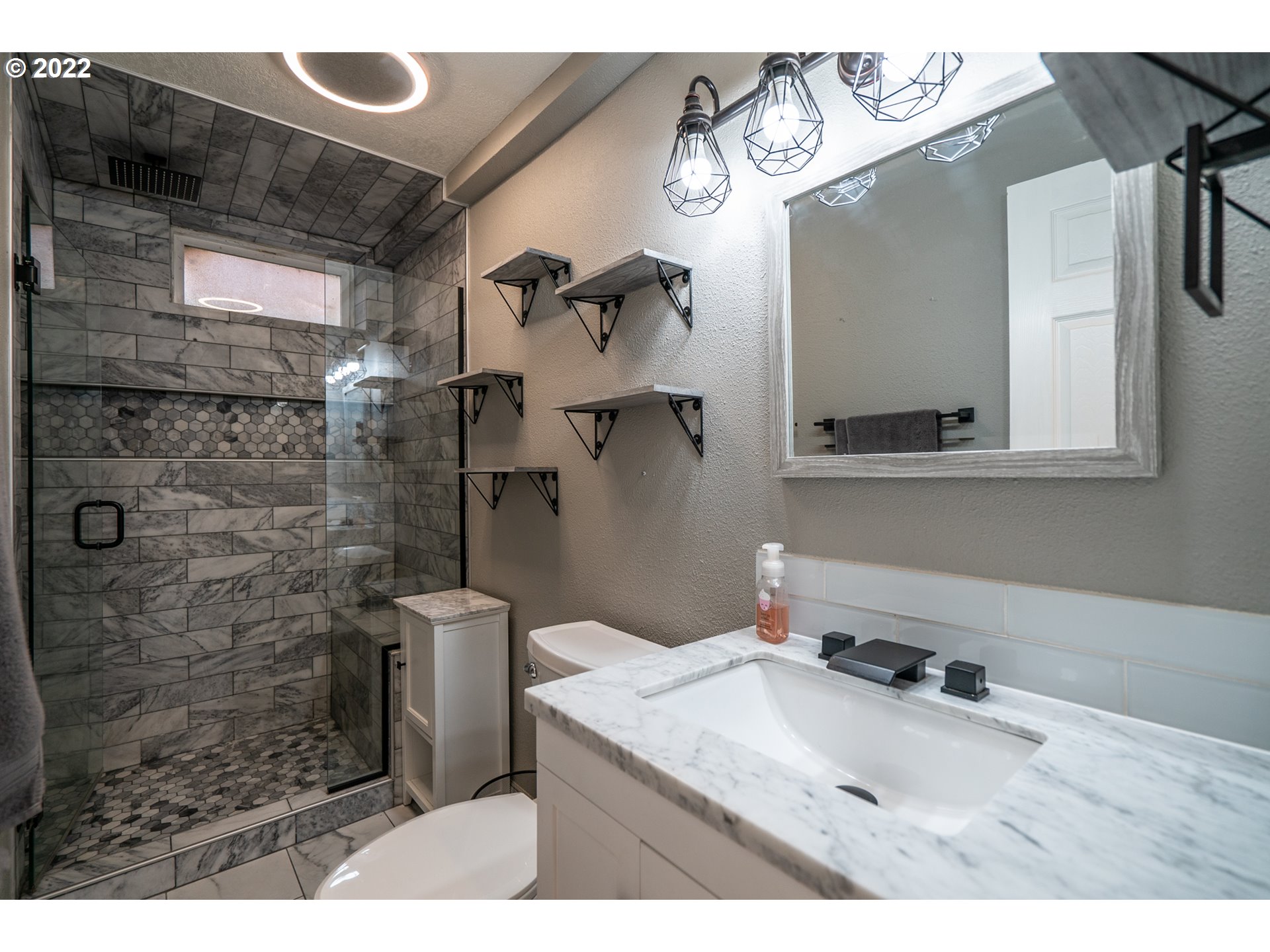 815 Northwest Mawrcrest Drive Gresham, OR 97030 - Photo 17 of 30 a bathroom with a sink mirror and shower