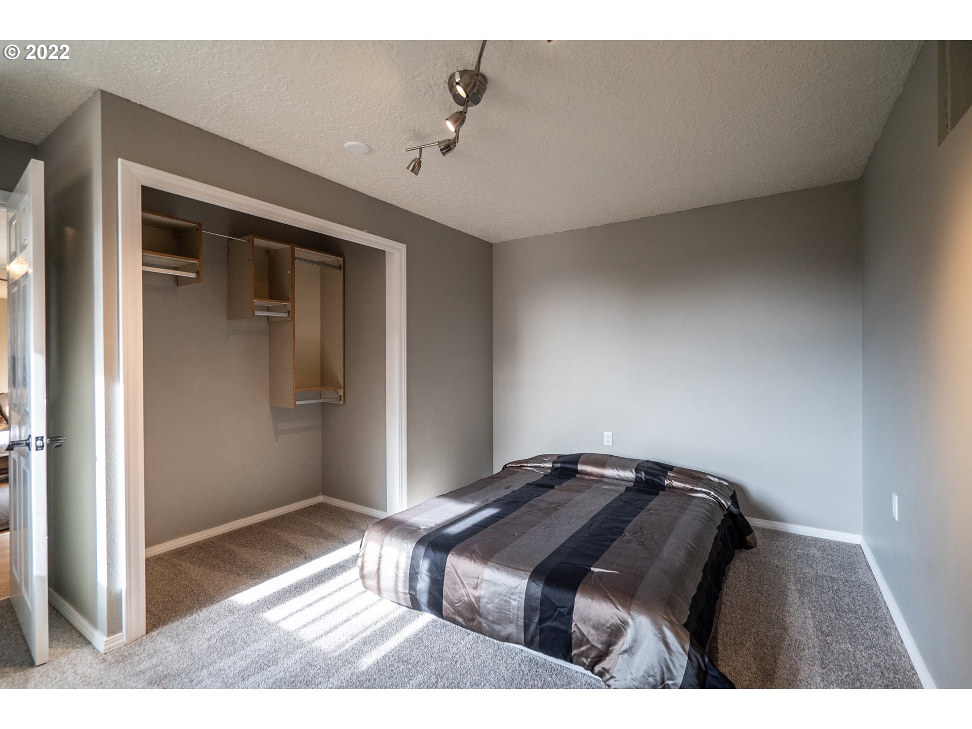 815 Northwest Mawrcrest Drive Gresham, OR 97030 - Photo 23 of 30 a bedroom with a bed and a mirror