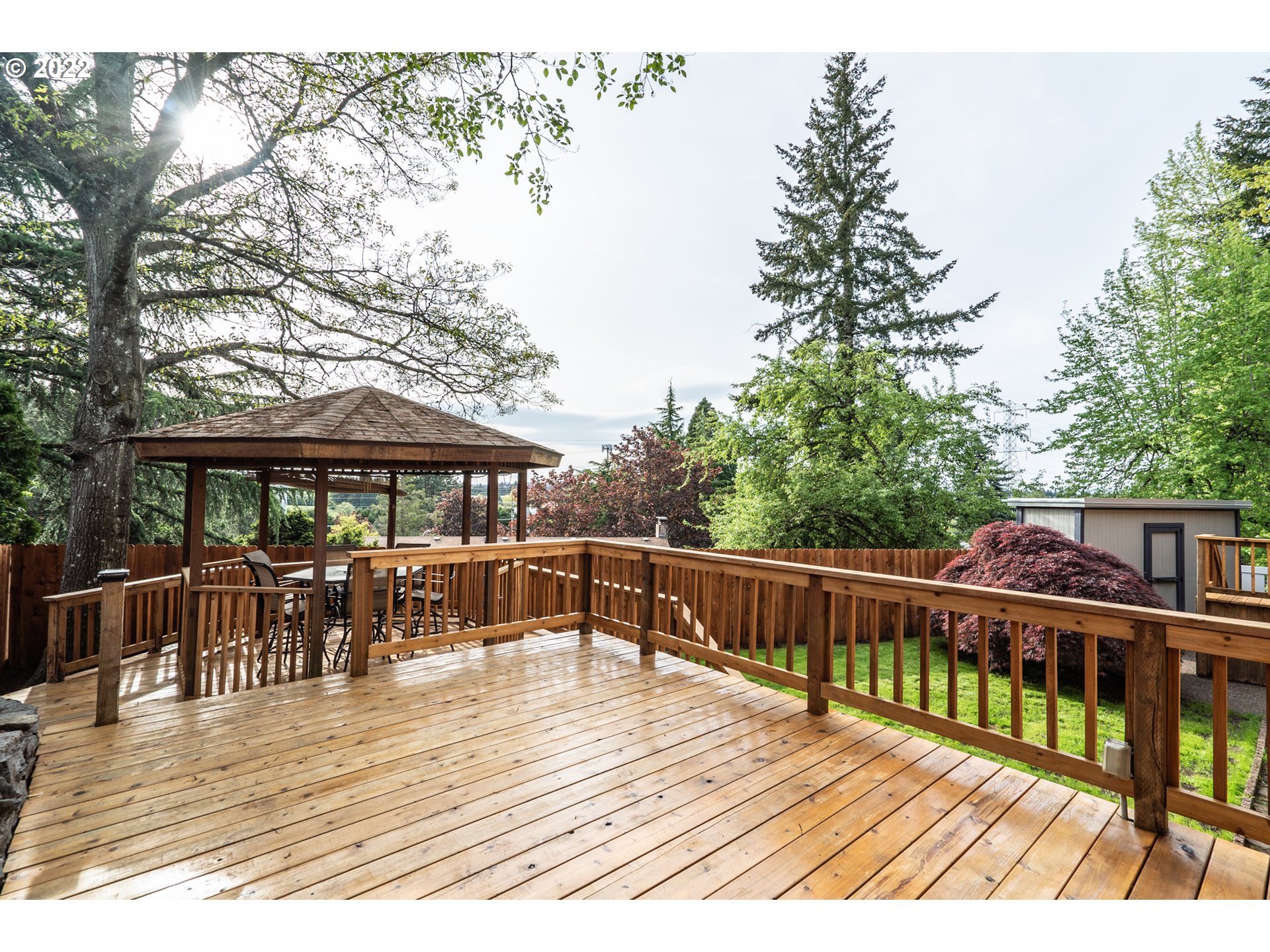 815 Northwest Mawrcrest Drive Gresham, OR 97030 - Photo 27 of 30 a view of a deck with furniture and trees