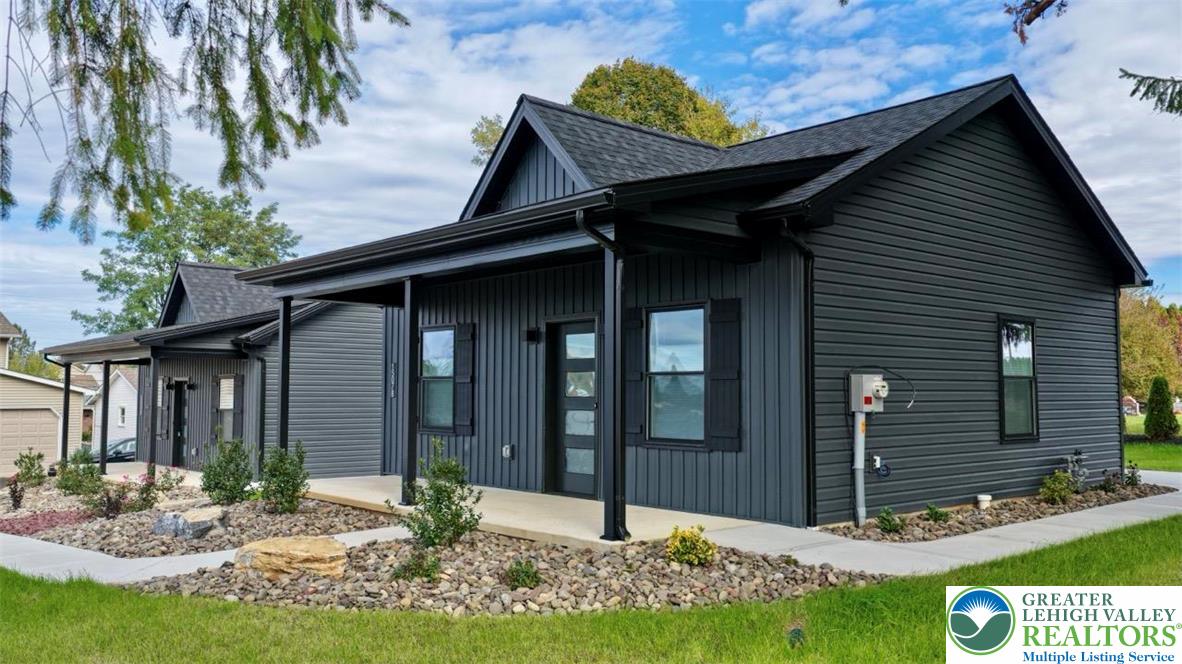 a front view of a house with garden