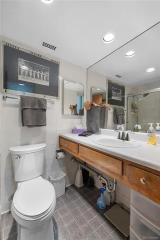 a view of a tall building next to a road