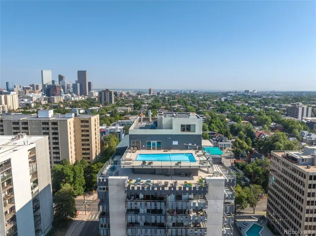 a buildings covered with tall trees