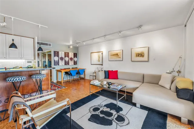 a bedroom with a bed and large windows