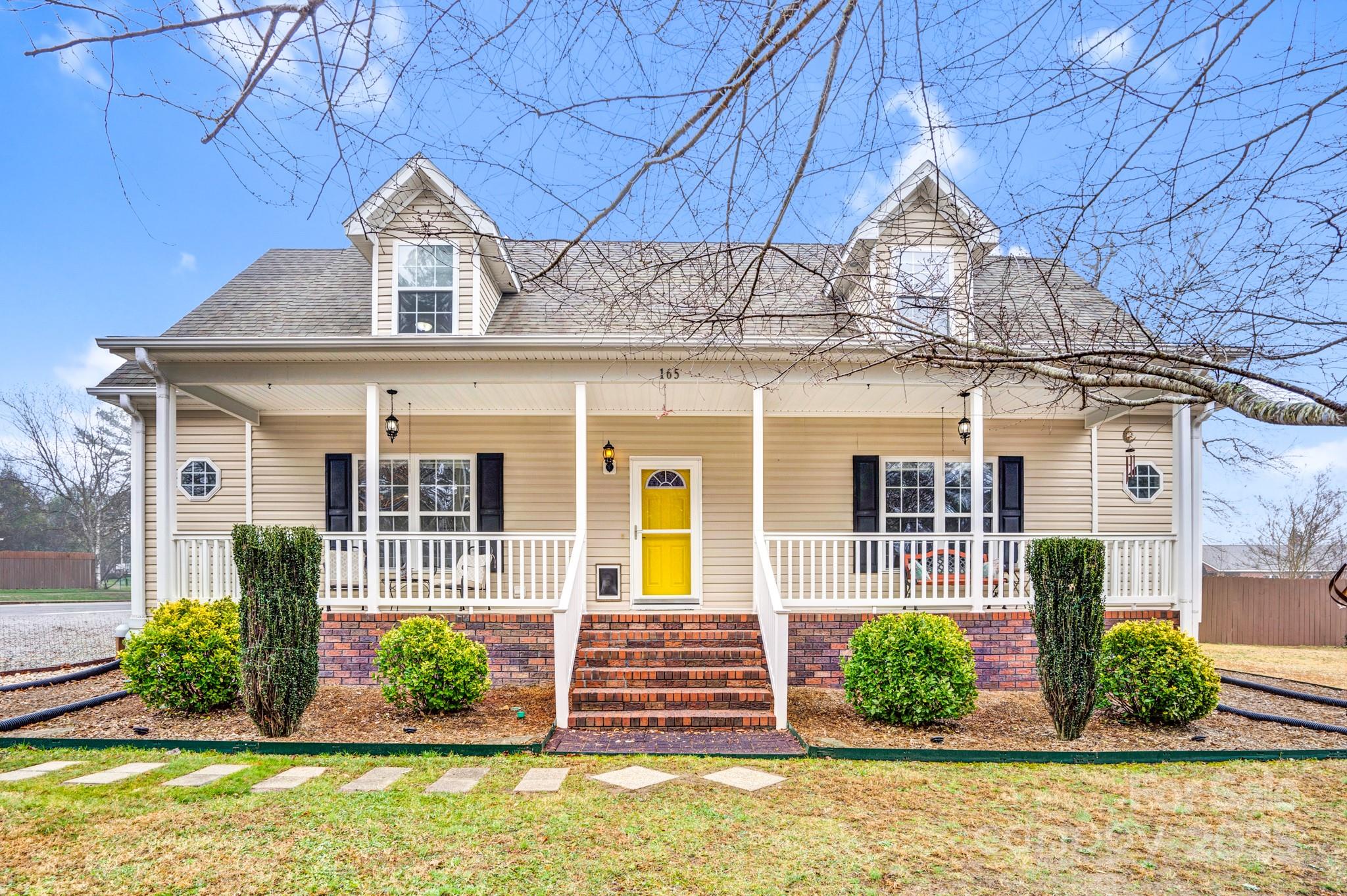 front view of a house with a yard