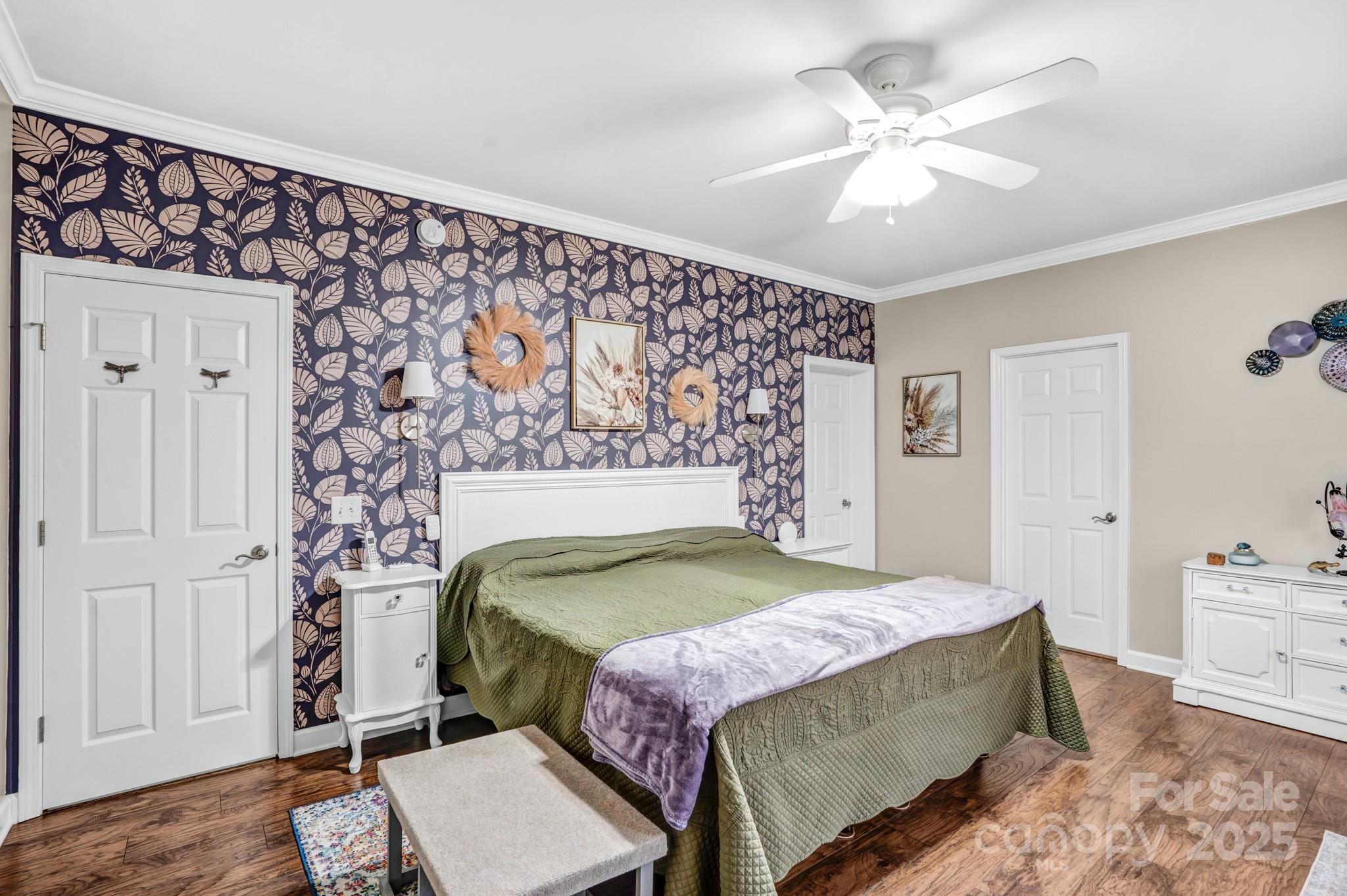 165 Kimball Loop China Grove, NC 28023 - Photo 21 of 48 a bedroom with a bed and a chandelier