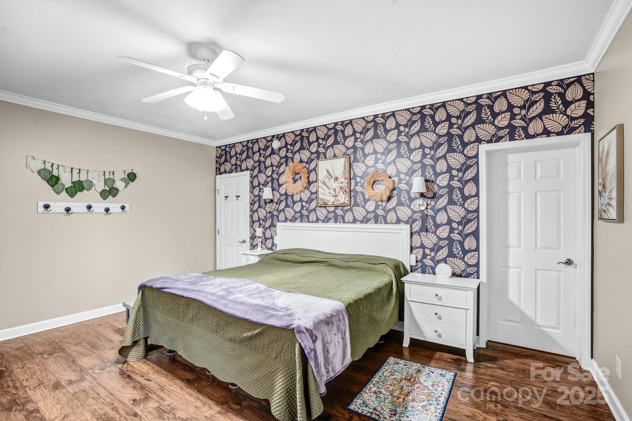 165 Kimball Loop China Grove, NC 28023 - Photo 22 of 48 a bedroom with a bed and a chandelier
