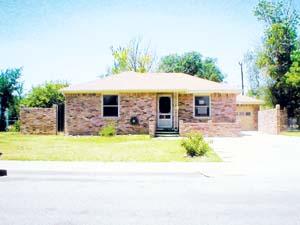 4410 Parker Street Amarillo, TX 79110 - Photo 1 of 1 a front view of house with outdoor space and trees around