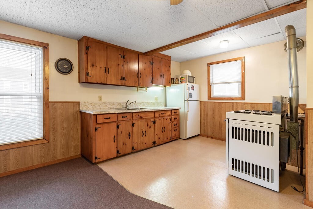 8 Boston Road Sutton, MA 01590 - Photo 17 of 30 a kitchen with stainless steel appliances a sink and a cabinets