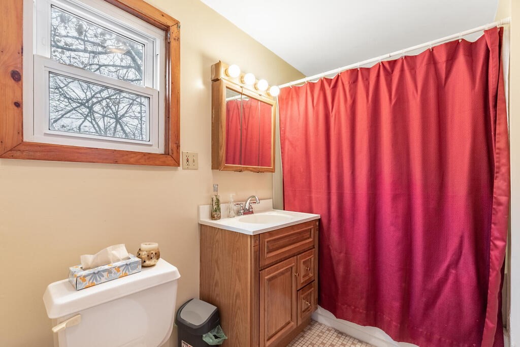 8 Boston Road Sutton, MA 01590 - Photo 19 of 30 a bathroom with a sink toilet and vanity