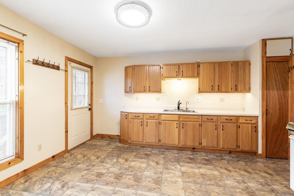 8 Boston Road Sutton, MA 01590 - Photo 21 of 30 a bathroom with a granite countertop sink and a mirror