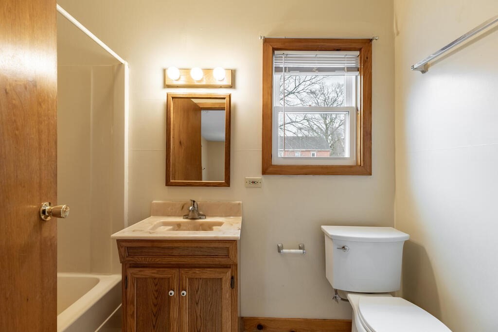 8 Boston Road Sutton, MA 01590 - Photo 23 of 30 a bathroom with a toilet a sink and mirror