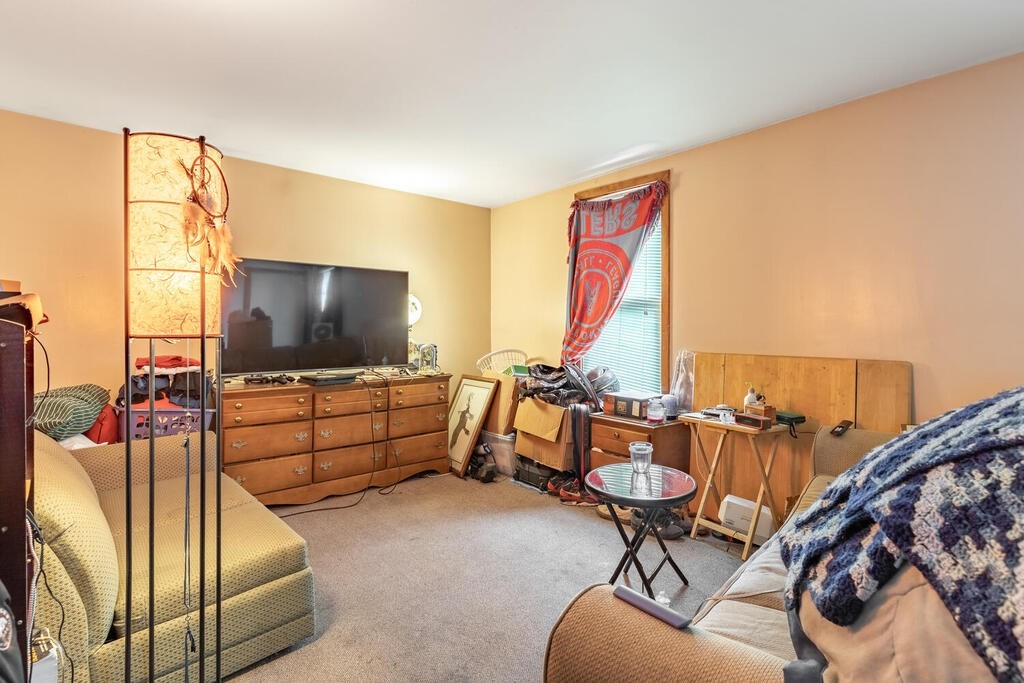8 Boston Road Sutton, MA 01590 - Photo 4 of 30 a living room with furniture and a flat screen tv
