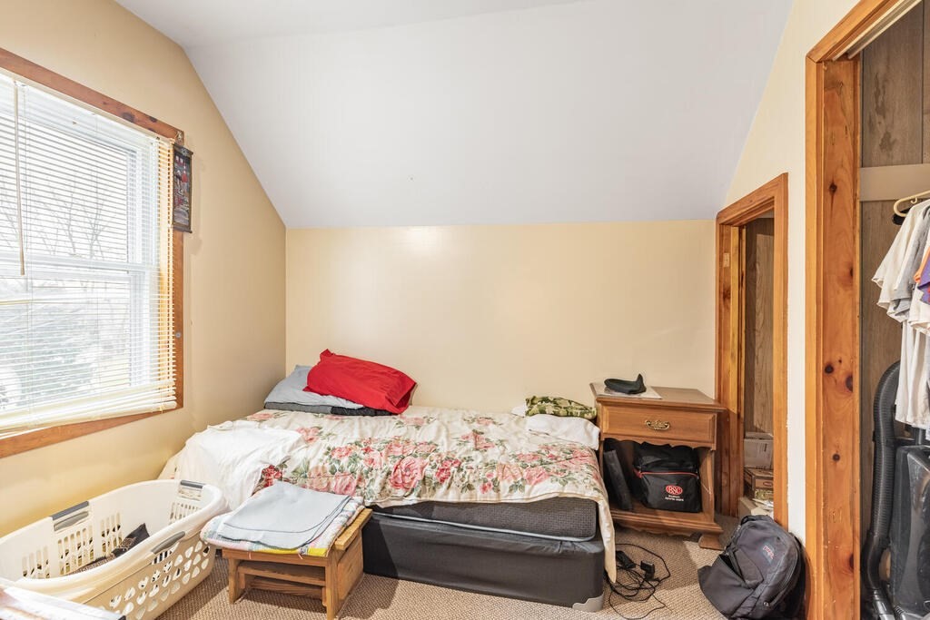 8 Boston Road Sutton, MA 01590 - Photo 9 of 30 a bedroom with a bed and a window