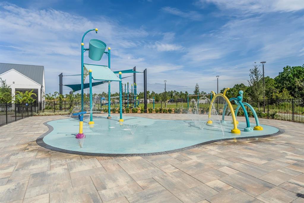 2851 House Finch Road St. Cloud, FL 34773 - Photo 47 of 52 a view of outdoor kitchen with green space