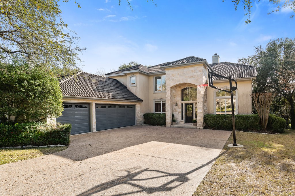a front view of a house with yard