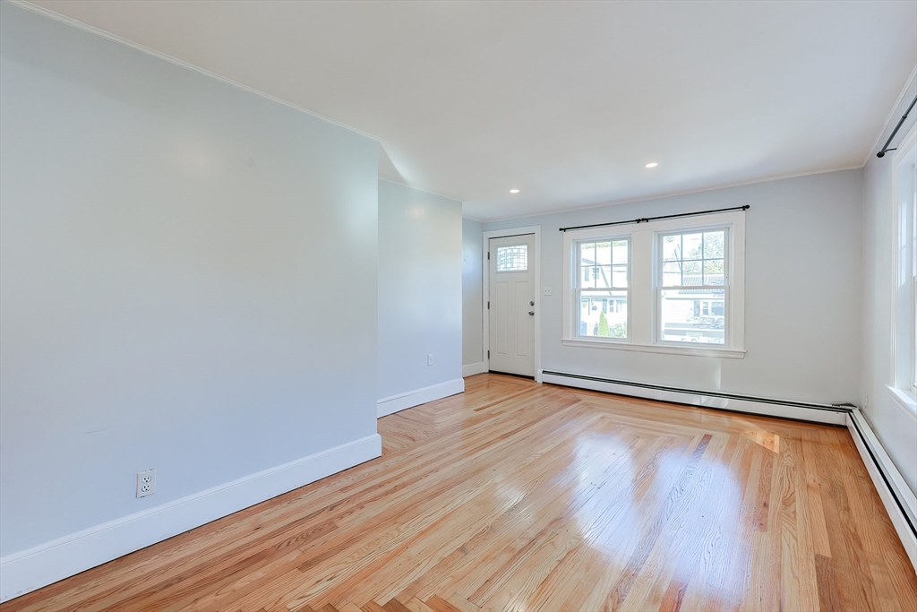 37 Maplewood Avenue Methuen, MA 01844 - Photo 11 of 42 a view of an empty room with wooden floor and window