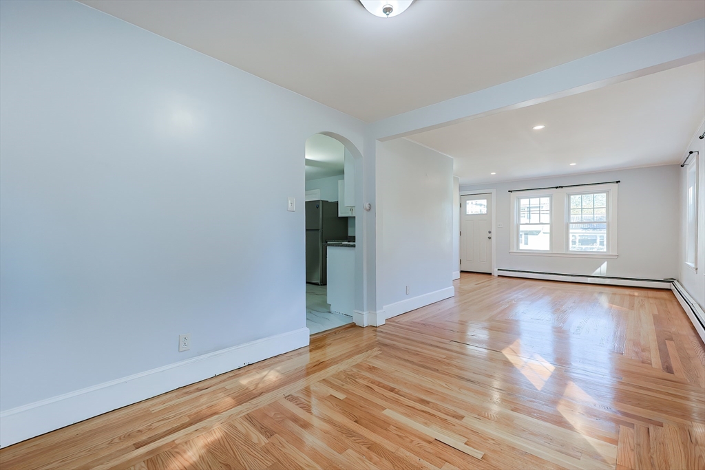 37 Maplewood Avenue Methuen, MA 01844 - Photo 12 of 42 wooden floor in an empty room with a window