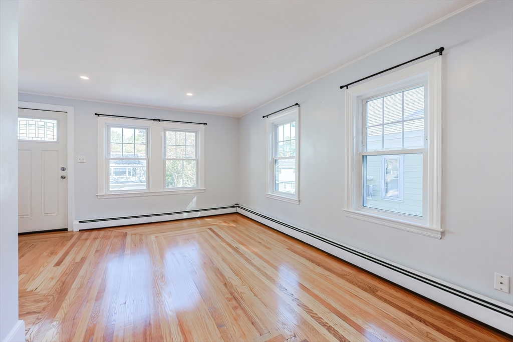 37 Maplewood Avenue Methuen, MA 01844 - Photo 13 of 42 a view of an empty room with wooden floor and a window