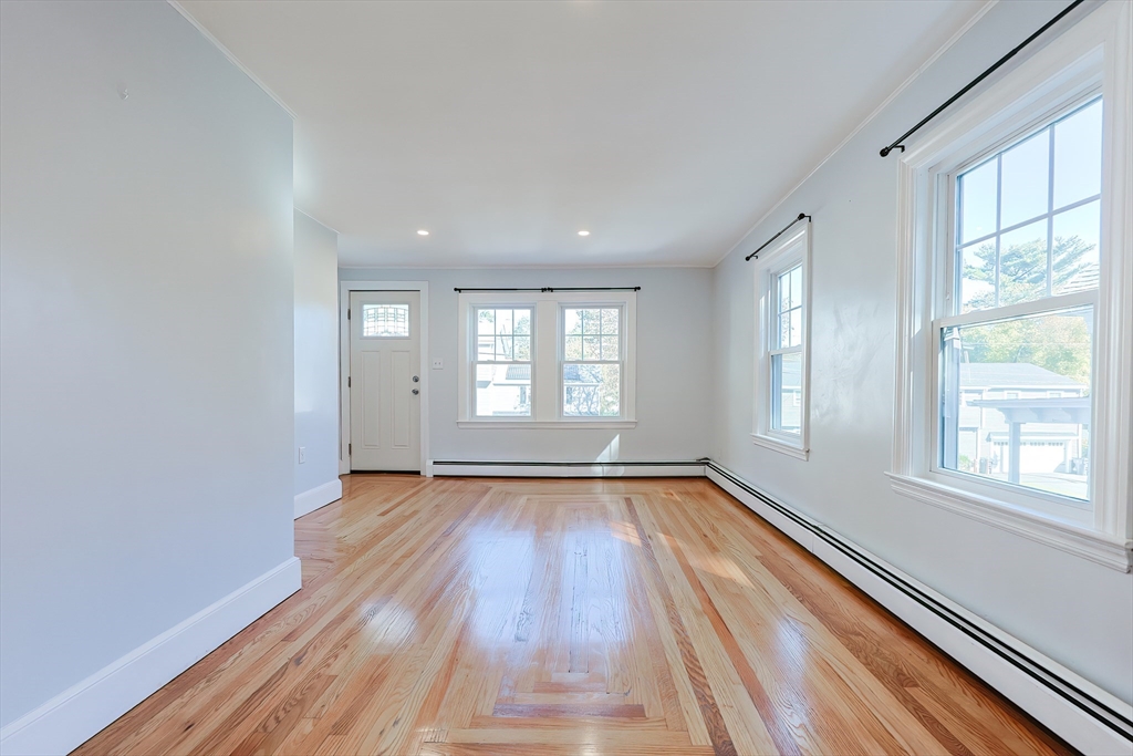37 Maplewood Avenue Methuen, MA 01844 - Photo 14 of 42 a view of an empty room with wooden floor and a window