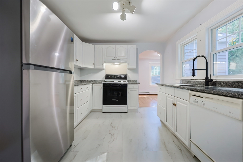 37 Maplewood Avenue Methuen, MA 01844 - Photo 17 of 42 a kitchen with stainless steel appliances granite countertop a stove a sink and a refrigerator