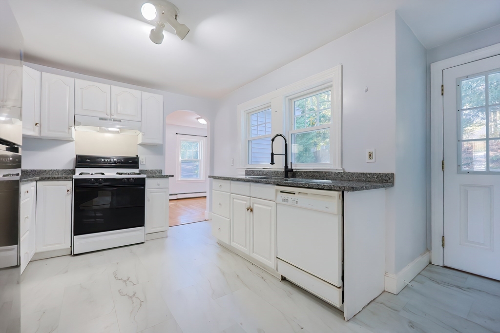 37 Maplewood Avenue Methuen, MA 01844 - Photo 20 of 42 a kitchen with granite countertop white cabinets and white appliances