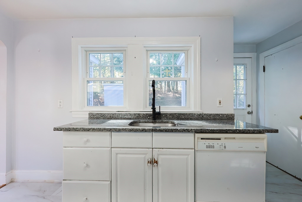 37 Maplewood Avenue Methuen, MA 01844 - Photo 21 of 42 a bathroom with a granite countertop sink and a mirror