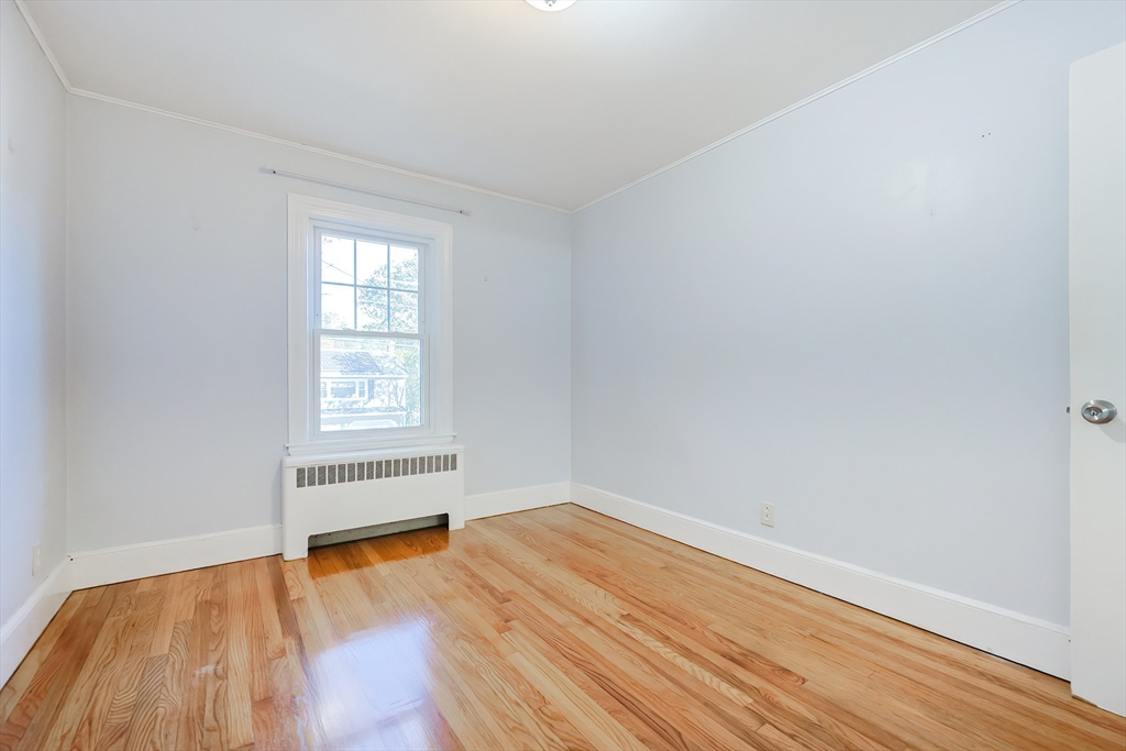 37 Maplewood Avenue Methuen, MA 01844 - Photo 25 of 42 an empty room with wooden floor and windows
