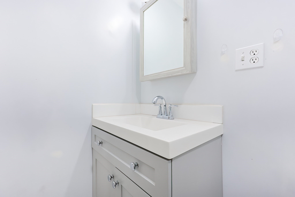 37 Maplewood Avenue Methuen, MA 01844 - Photo 27 of 42 a bathroom with a sink and a mirror