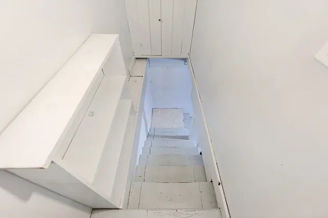 a view of a room with wooden walls