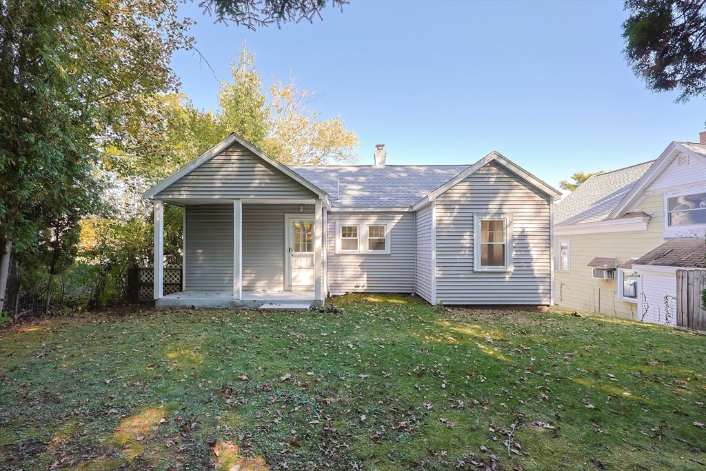 37 Maplewood Avenue Methuen, MA 01844 - Photo 37 of 42 a front view of a house with a yard and garage