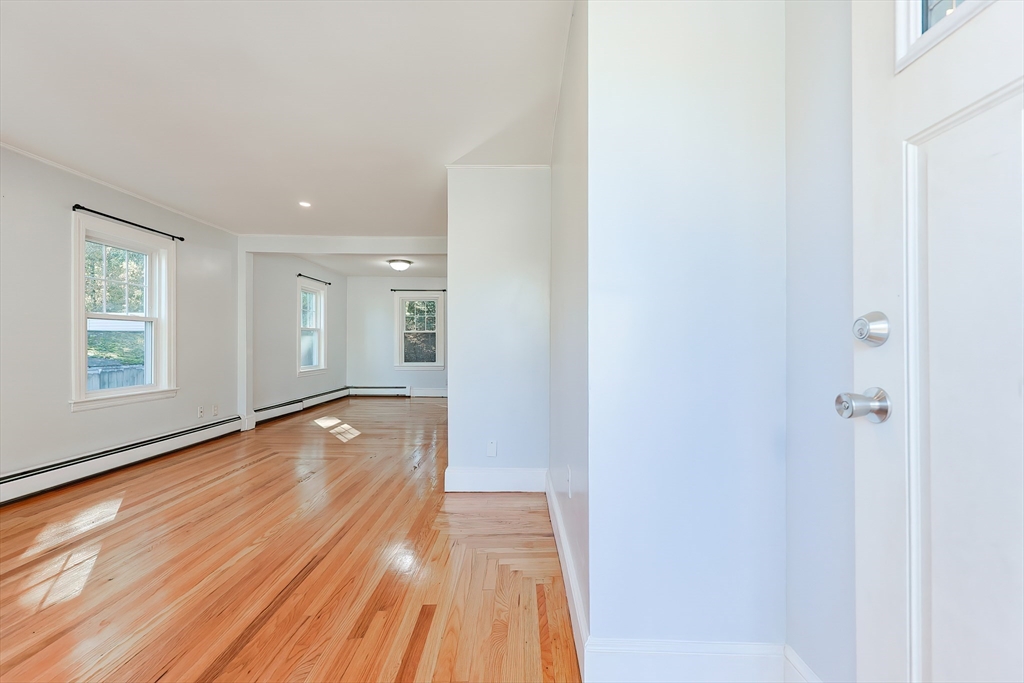 37 Maplewood Avenue Methuen, MA 01844 - Photo 7 of 42 a view of an empty room with wooden floor and a window