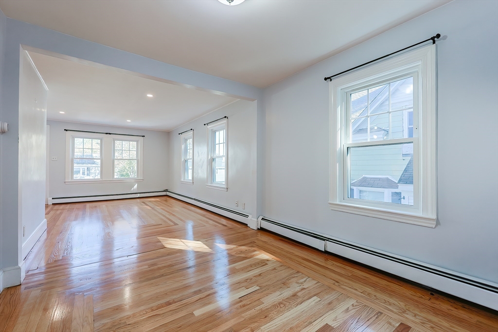 37 Maplewood Avenue Methuen, MA 01844 - Photo 8 of 42 a view of an empty room with wooden floor and a window