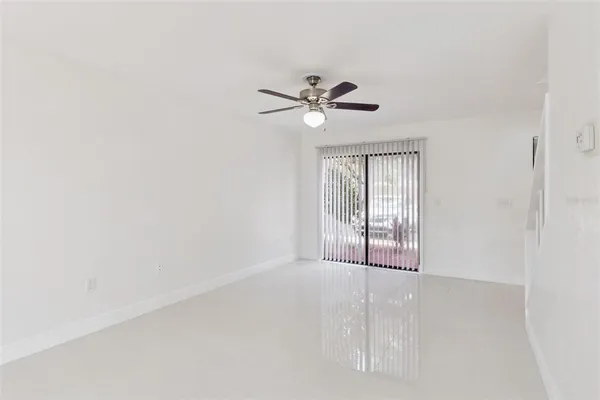 a view of an empty room with a window