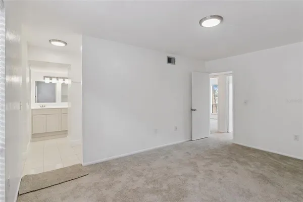 an empty room with closet area