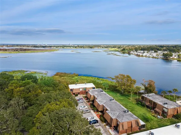 an aerial view of a city and lake view