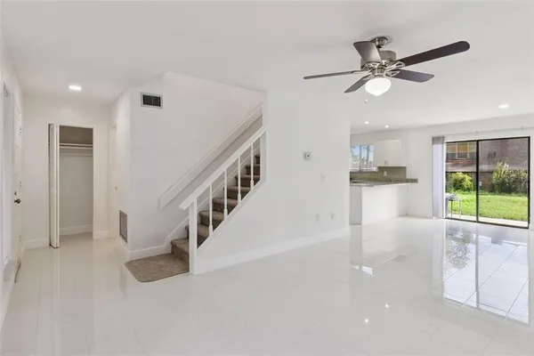a view of an entryway with wooden floor
