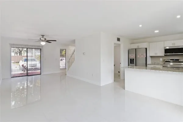 a view of a kitchen and window