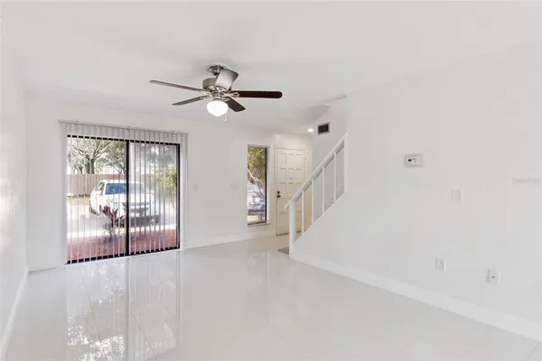 a view of a livingroom with a ceiling fan