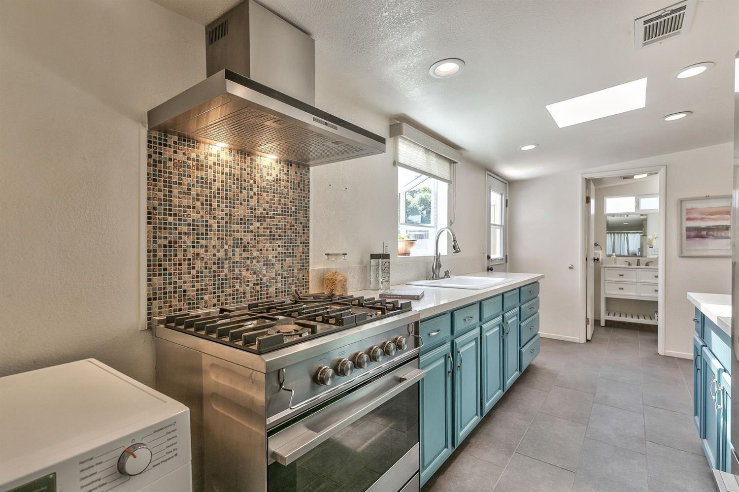668 Spring Street Oak View, CA 93022 - Photo 11 of 24 a kitchen with a stove and a refrigerator