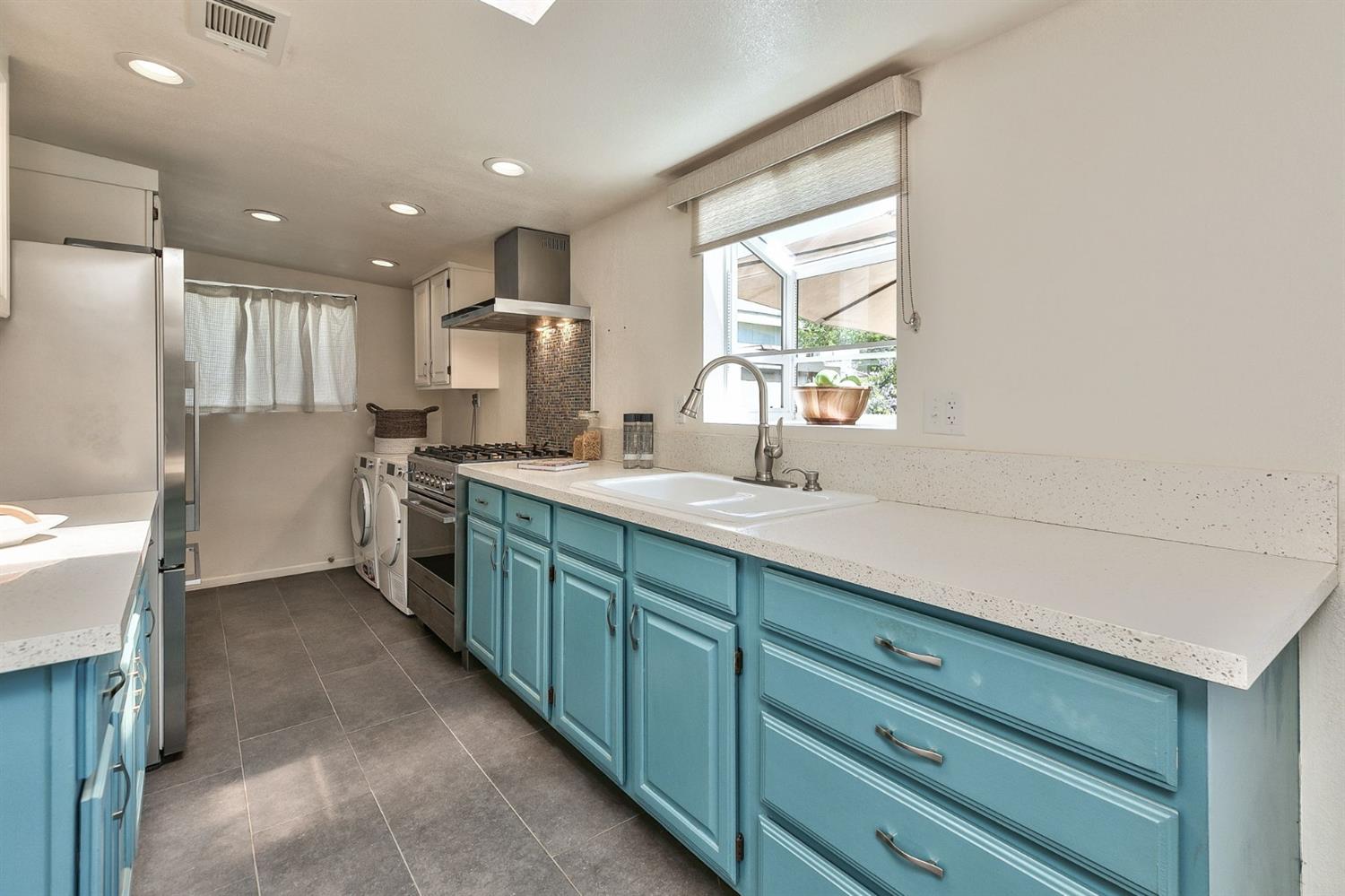668 Spring Street Oak View, CA 93022 - Photo 13 of 24 a kitchen with a sink cabinets and window