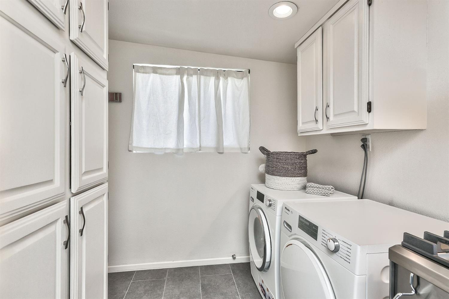668 Spring Street Oak View, CA 93022 - Photo 18 of 24 a utility room with dryer and washer