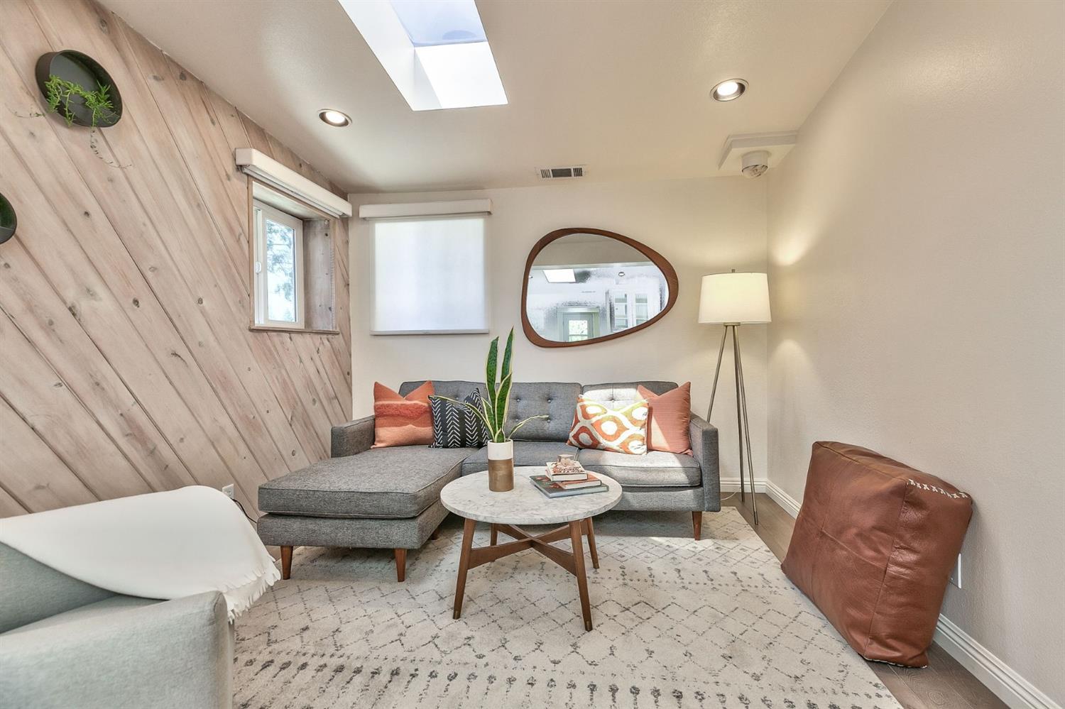 668 Spring Street Oak View, CA 93022 - Photo 7 of 24 a living room with furniture a clock and a rug