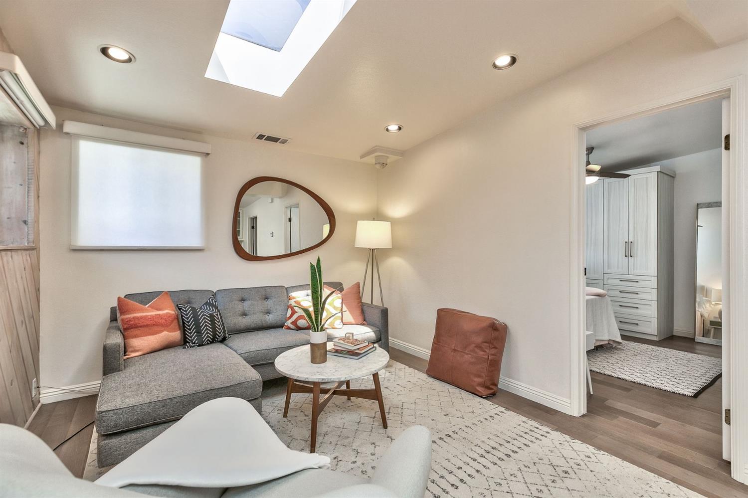 668 Spring Street Oak View, CA 93022 - Photo 8 of 24 a living room with furniture a mirror and a painting