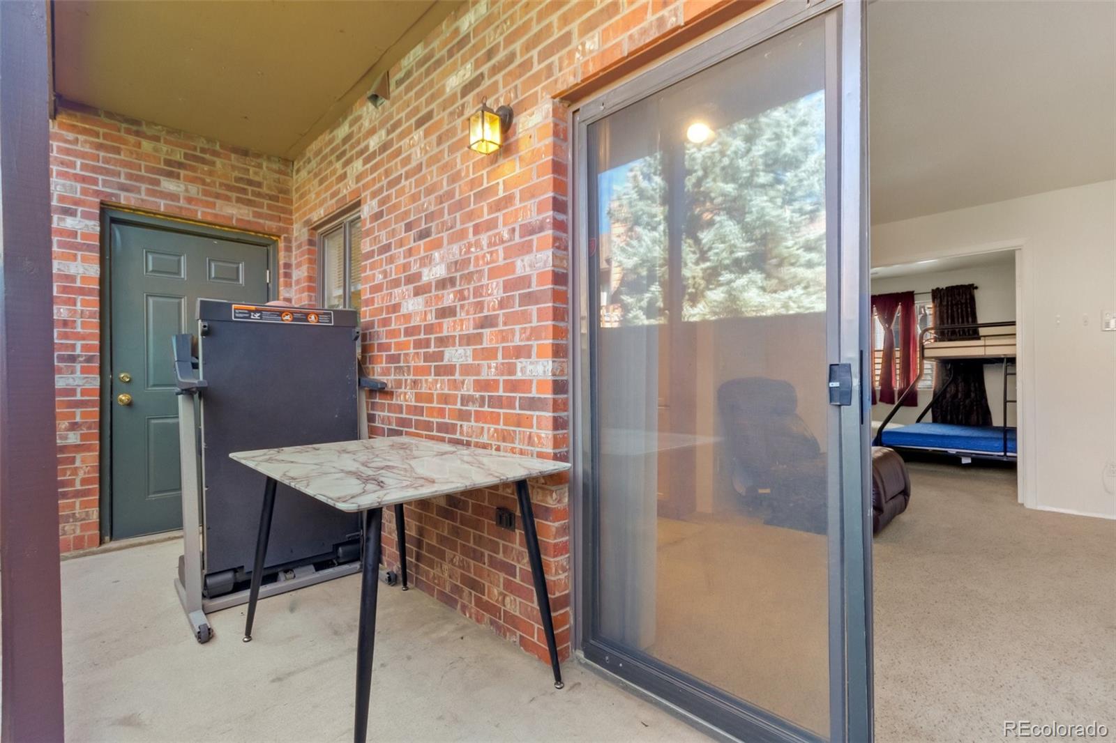 2265 South Buckley Road, Unit 102 Aurora, CO 80013 - Photo 18 of 28 a view of a dining room with furniture and a window