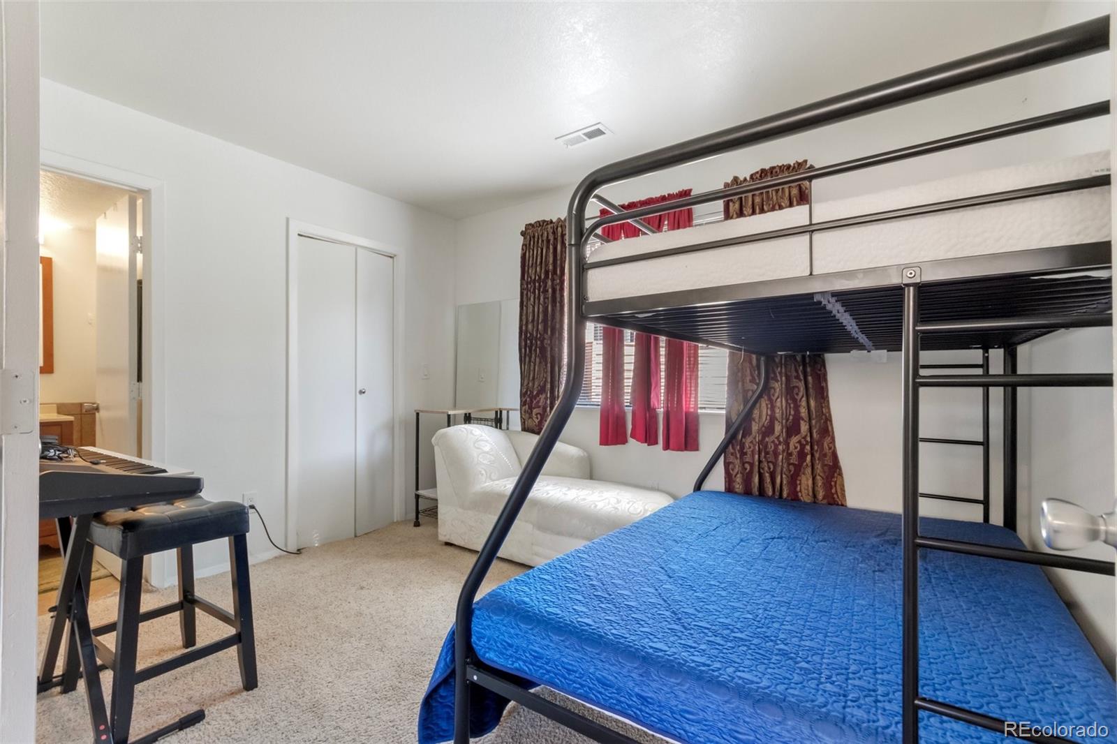 2265 South Buckley Road, Unit 102 Aurora, CO 80013 - Photo 20 of 28 a view of a room with furniture and wooden floor