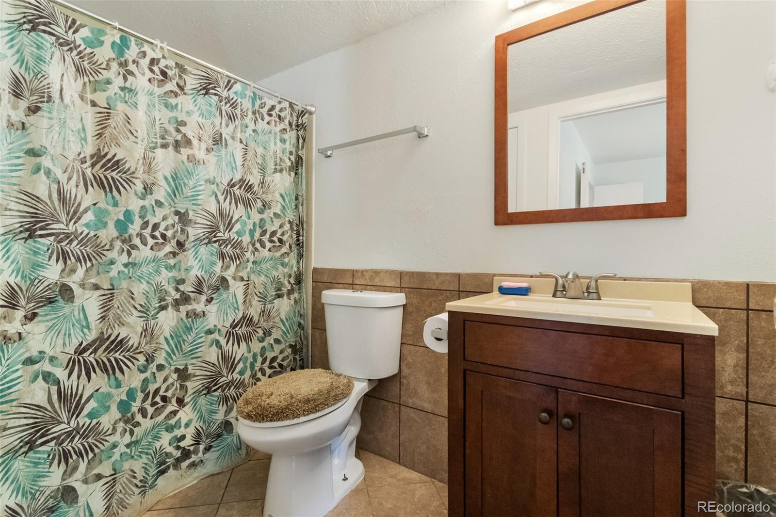 2265 South Buckley Road, Unit 102 Aurora, CO 80013 - Photo 23 of 28 a bathroom with a toilet and a sink
